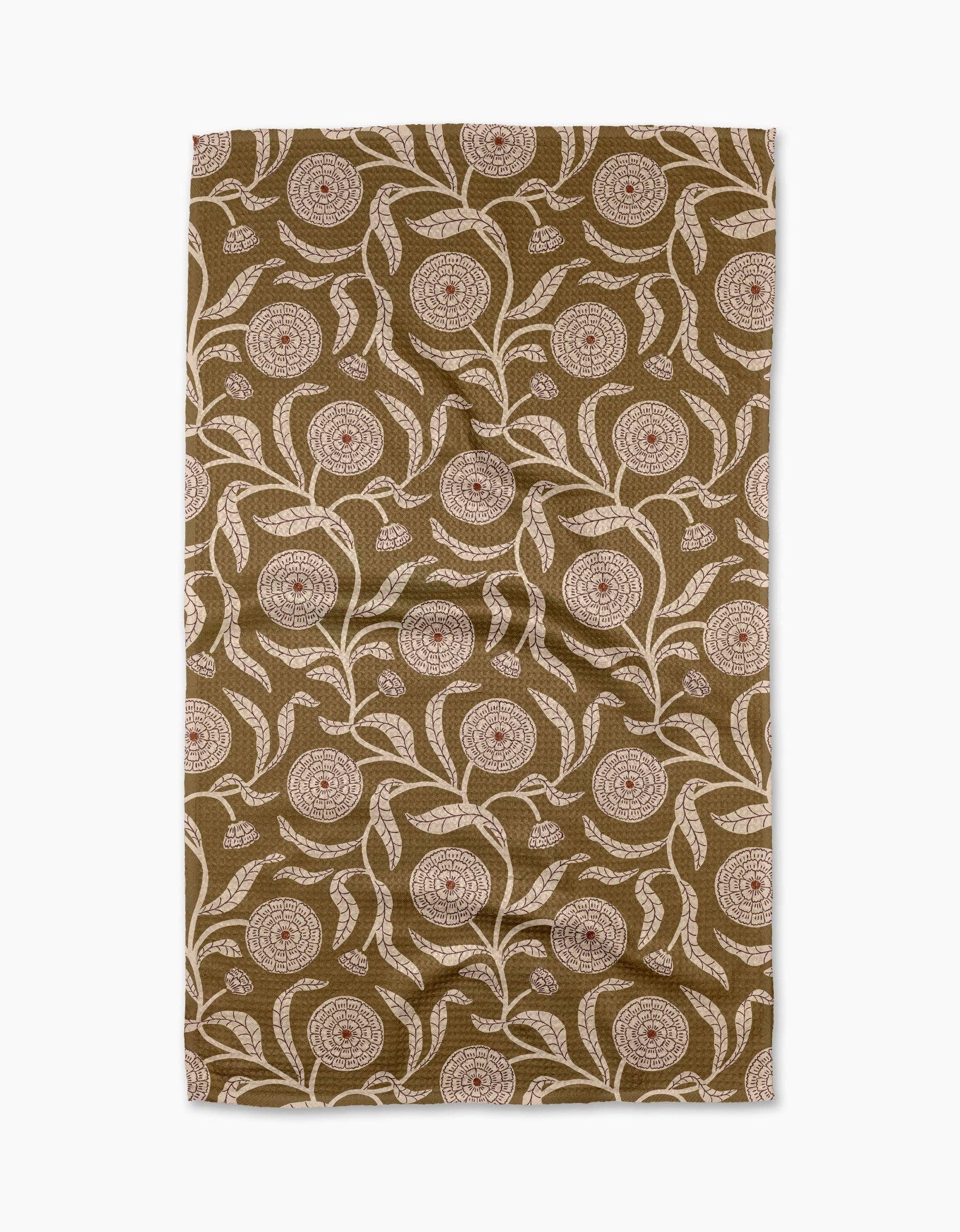 Patterned towel with floral design on a brown background