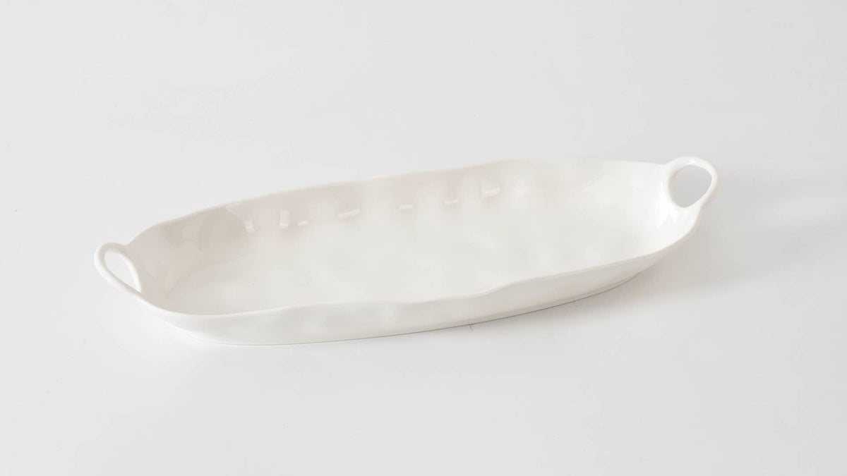 White ceramic platter on a light gray background