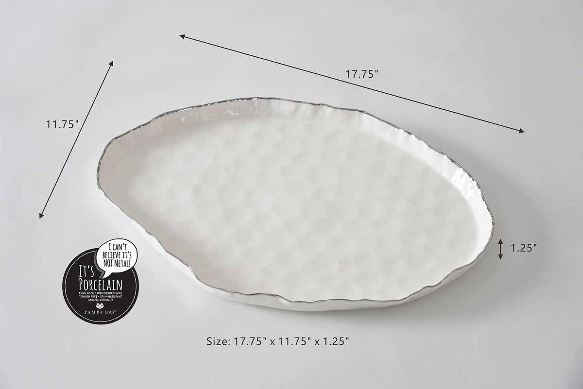 Oval-shaped ceramic plate with measurements on a light gray background