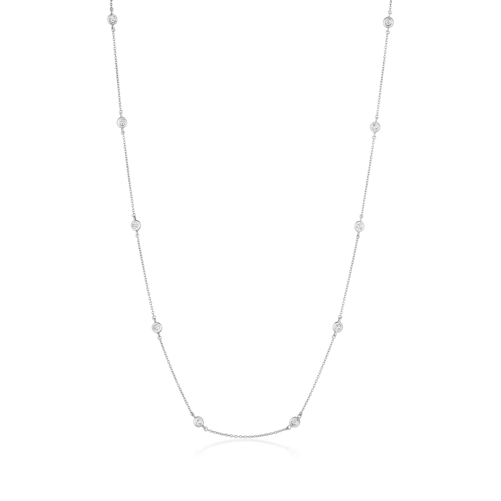Silver necklace with small gems on a white background