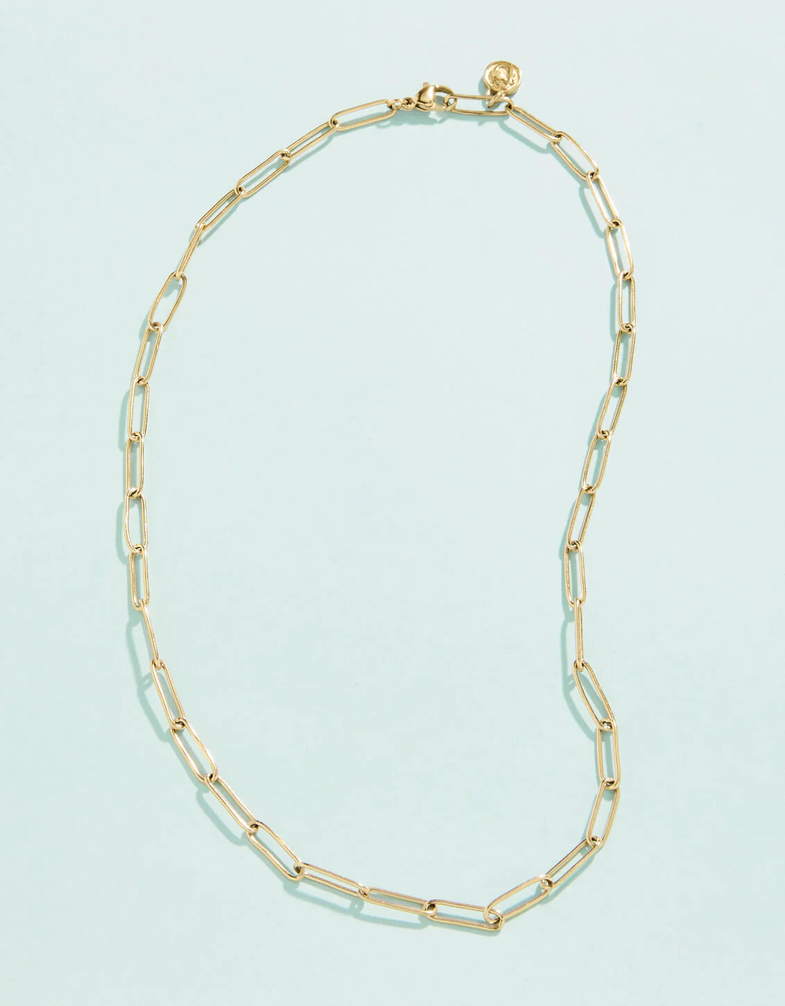 A gold-colored necklace with a chain link design, featuring a lobster clasp closure.