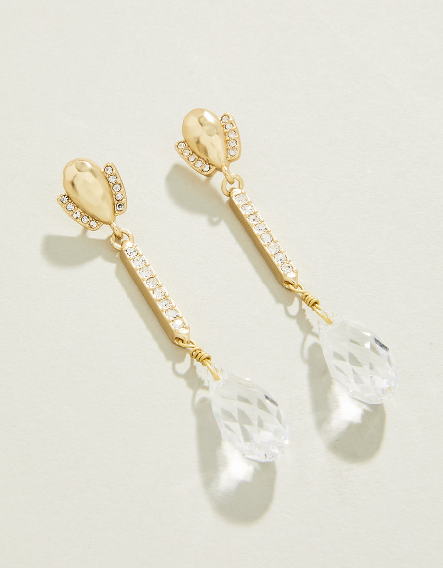 A pair of dangle earrings with a gold plating and adorned with clear glass crystals.