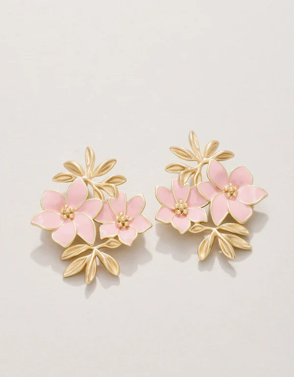 A pair of gold-plated earrings featuring pink enamel floral designs.
