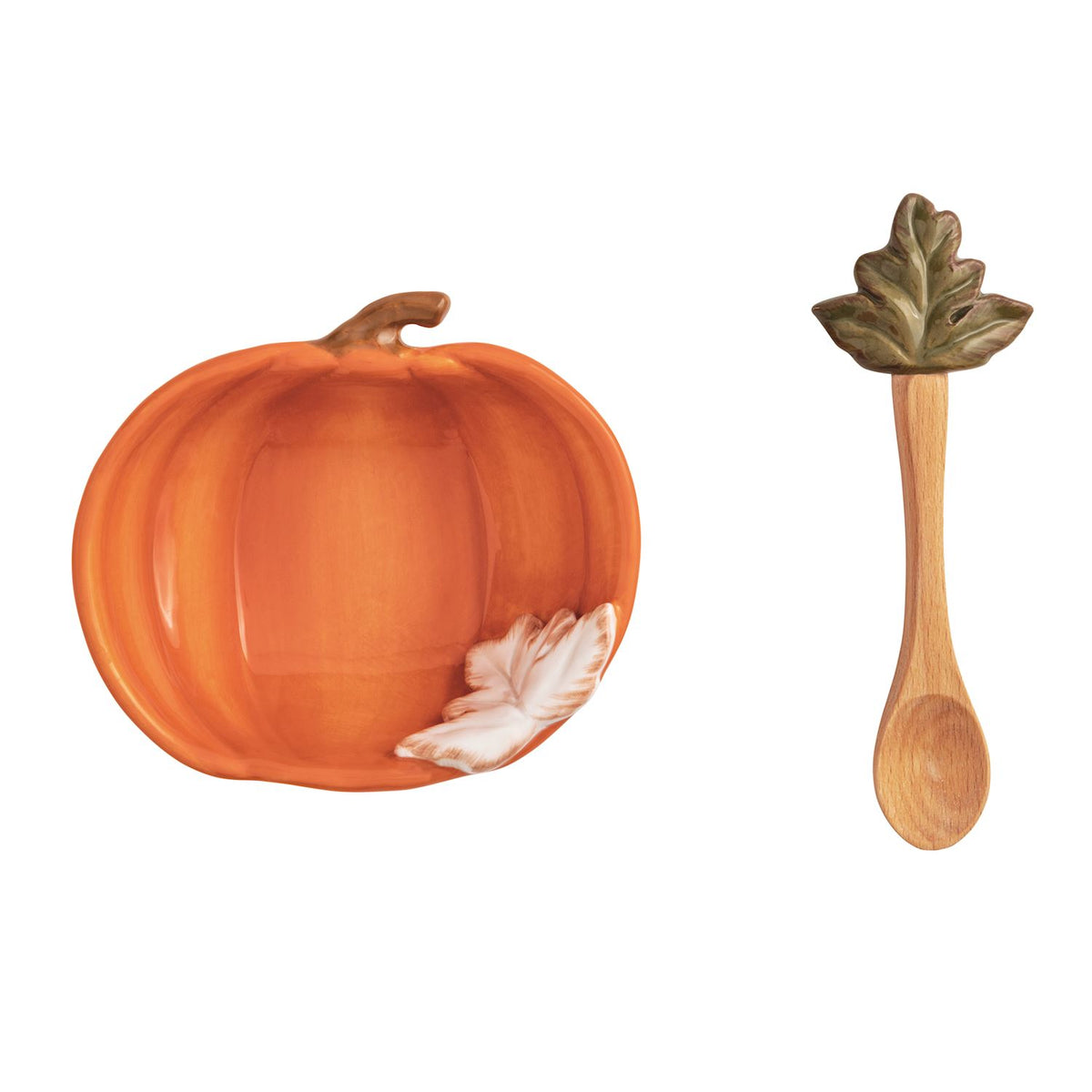 Pumpkin-shaped plate with a wooden spoon on a white background