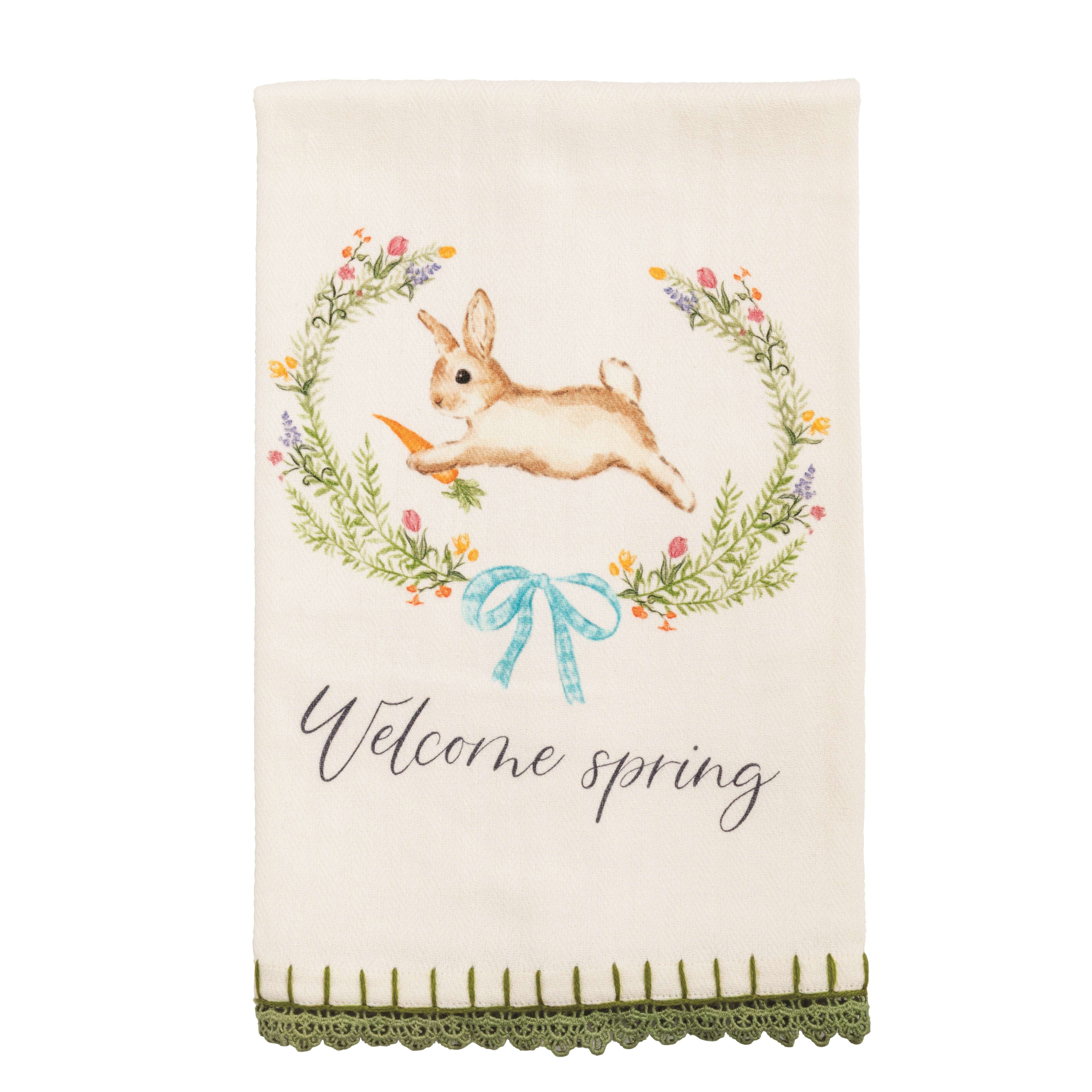 Decorative towel with a bunny and floral wreath design, featuring the text 'Welcome spring'.