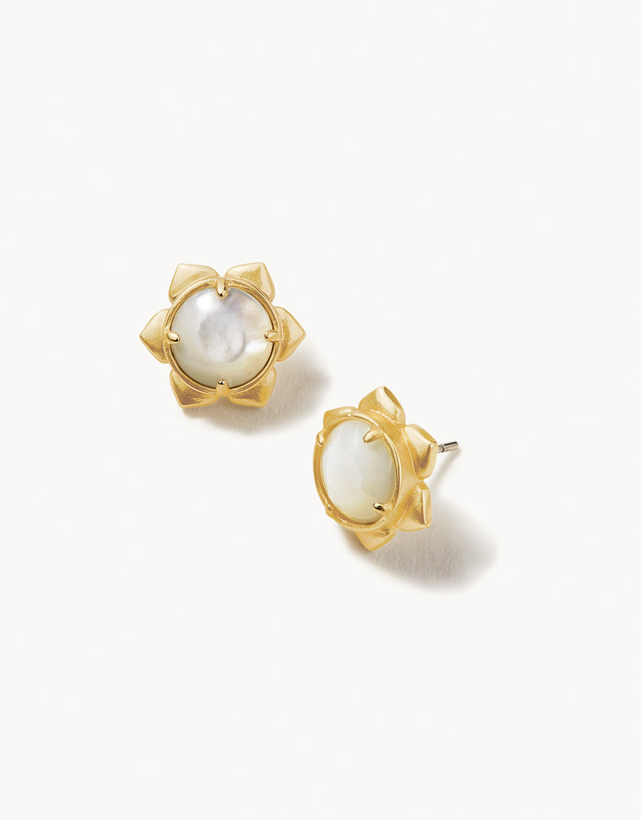 A pair of gold-plated stud earrings featuring a mother-of-pearl center, with a matte finish.