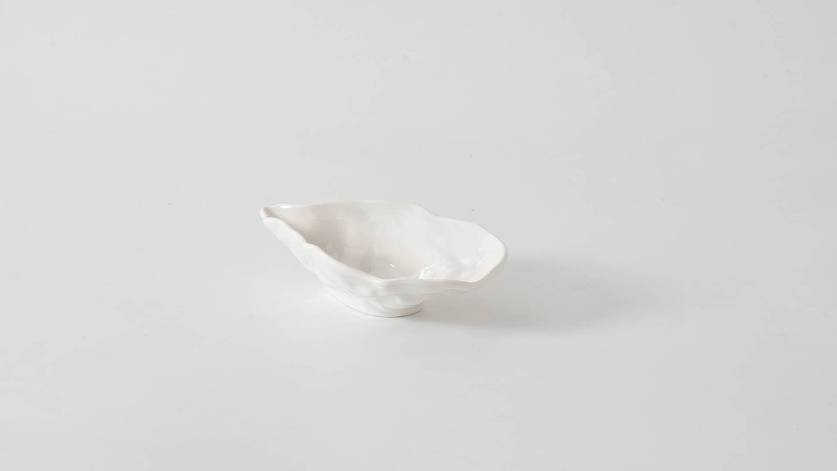 White ceramic dish on a light gray background