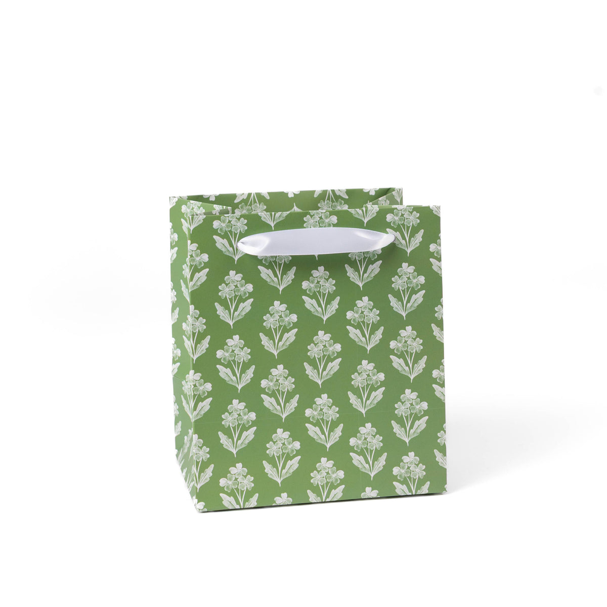 Green gift bag with white floral pattern on a white background