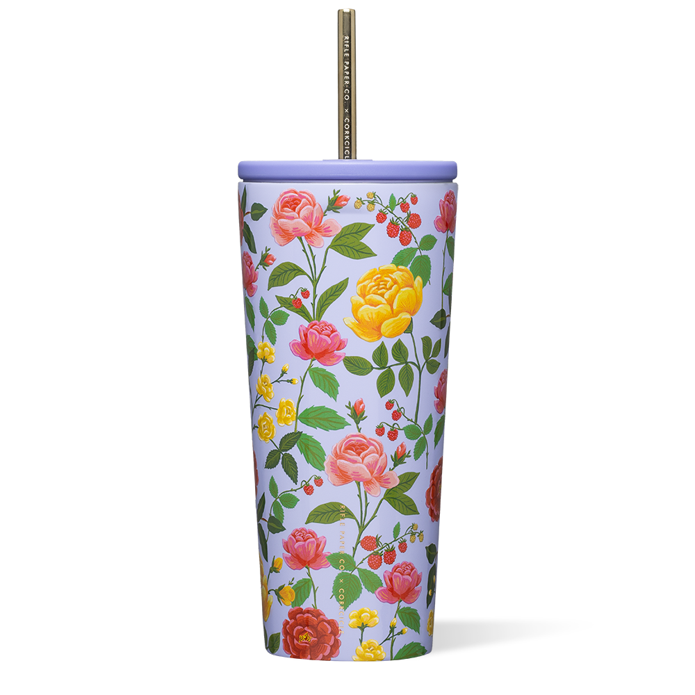 Floral-patterned tumbler with a straw on a white background