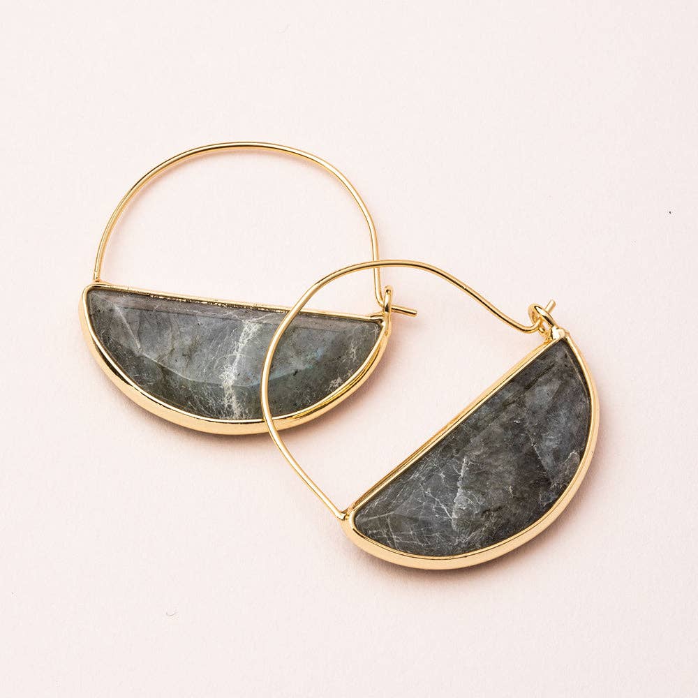 A pair of hoop earrings with one earring featuring a gold-colored wire and the other earring featuring a silver-colored wire, both with semi-precious half-circle stone attachments.