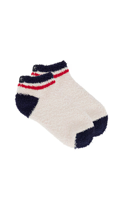 Pair of socks with navy and red accents on a white background