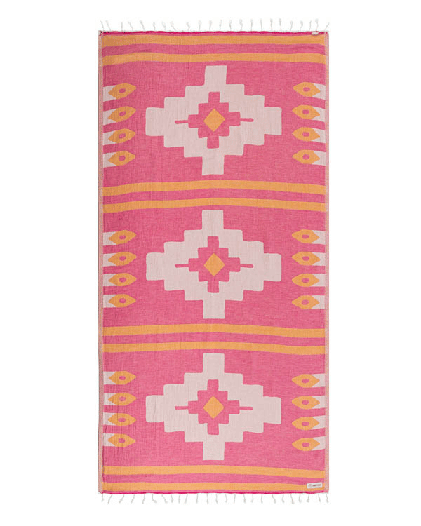 Pink towel with geometric patterns on a white background