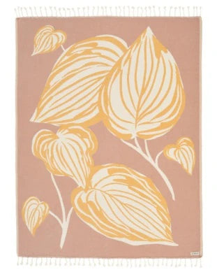 A taupe-colored blanket with a jacquard weave and twisted tassels, featuring a leaf-inspired design.