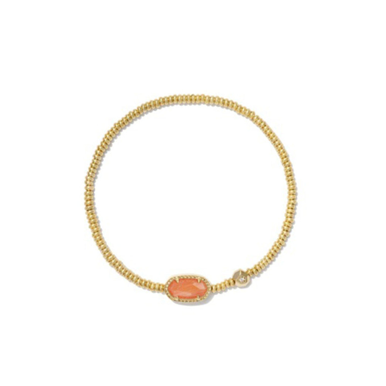 Gold bracelet with a coral stone on a white background