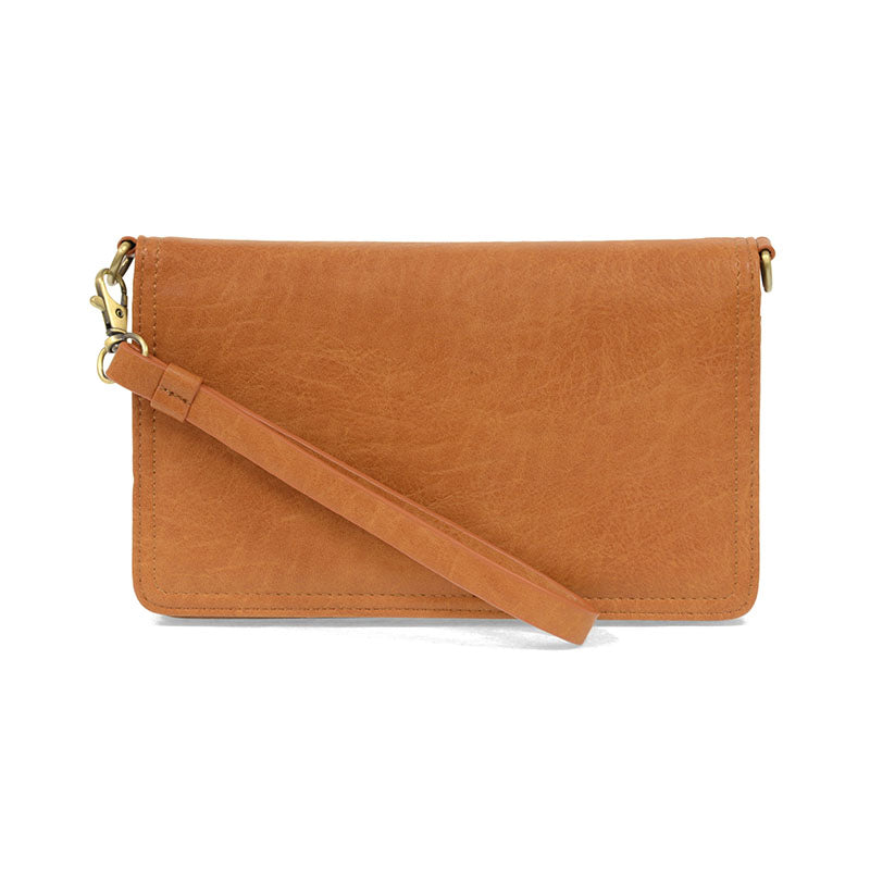 Brown leather clutch with a strap on a white background