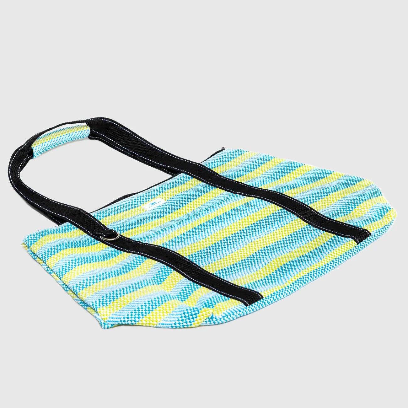 Blue and yellow striped bag with a black strap on a light gray background