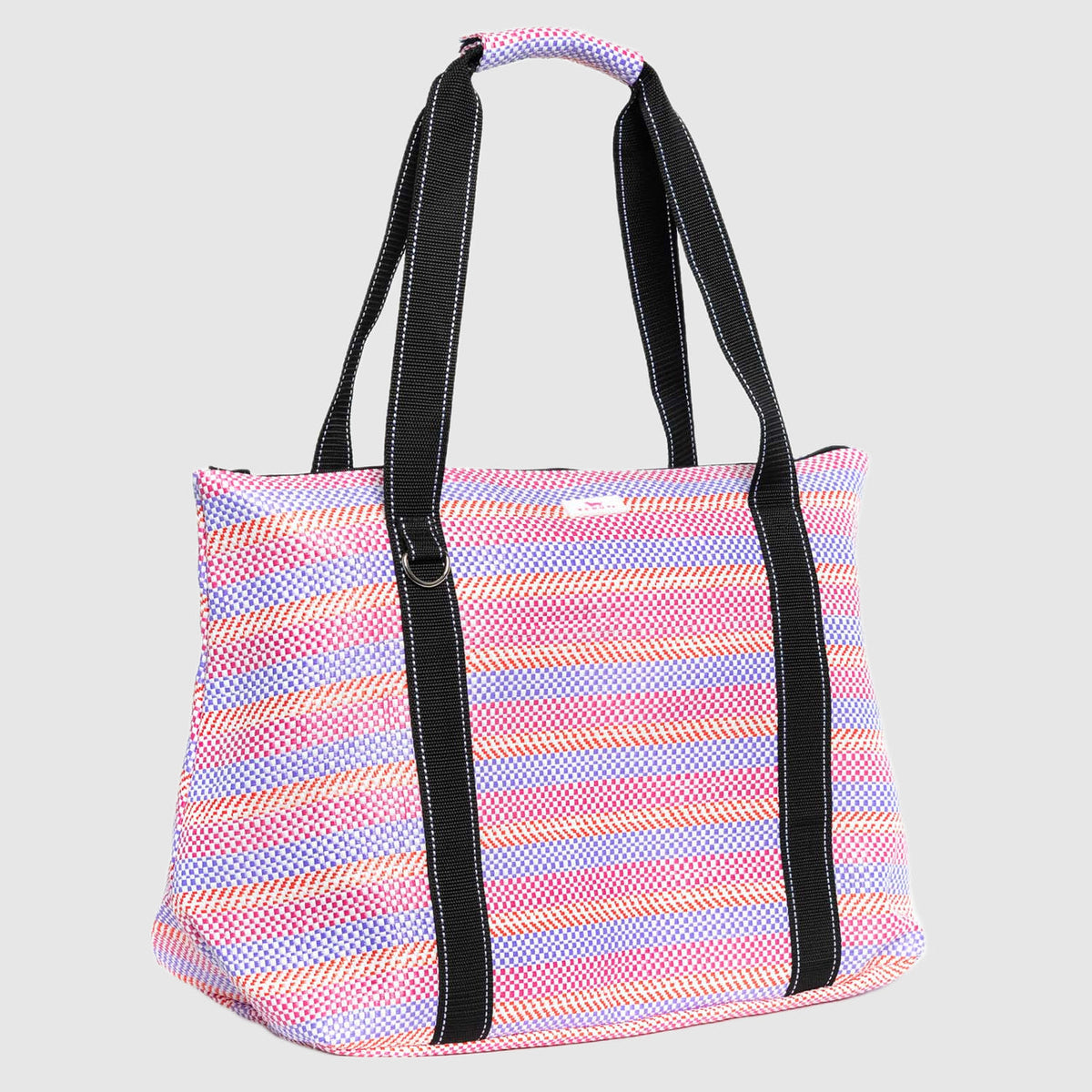 Striped tote bag with black handles on a light gray background