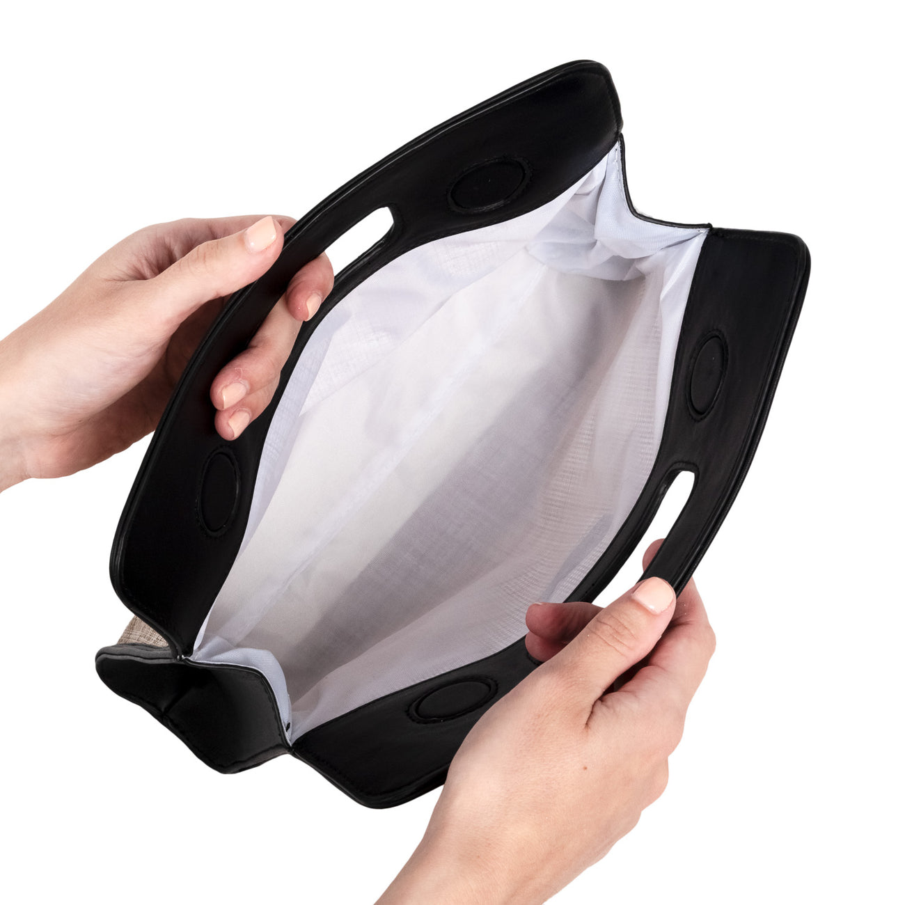 Black and white mesh bag held by hands on a white background