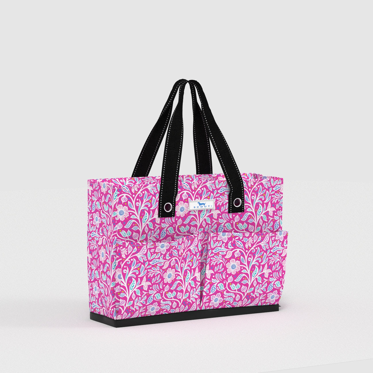 Pink floral tote bag with black handles on a light gray background