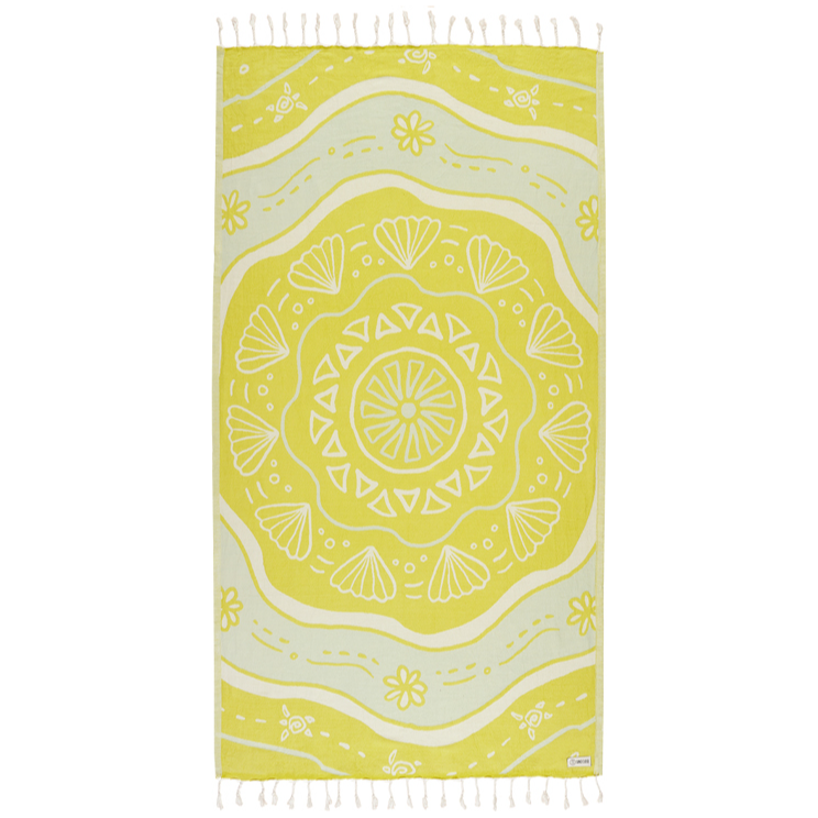 Yellow beach towel with white geometric pattern on a white background