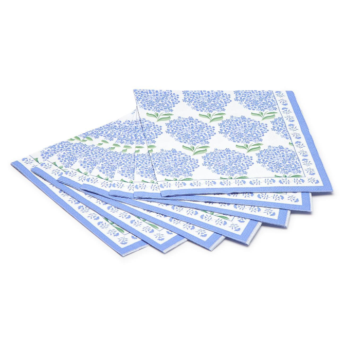 A stack of blue 3-ply paper cocktail napkins with a hydrangea floral pattern