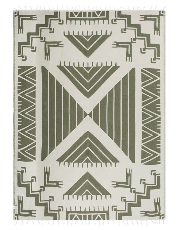 Geometric patterned blanket with green and beige design on a white background