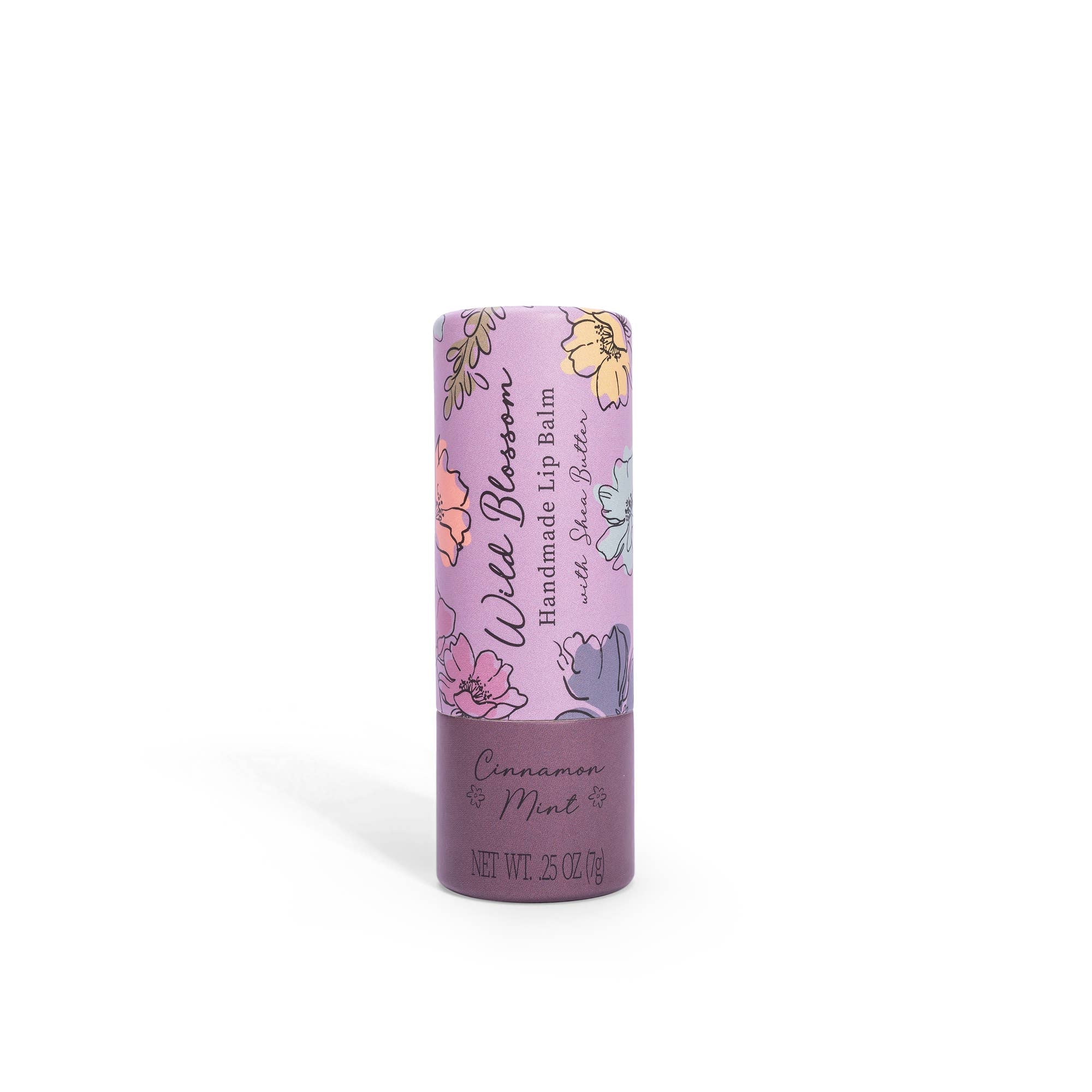 A stick of Wild Blossom Lip Balm with Cinnamon Mint flavor, packaged in a purple tube with floral designs.
