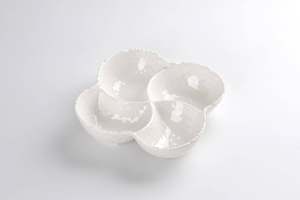 Set of three white ceramic bowls on a light gray background