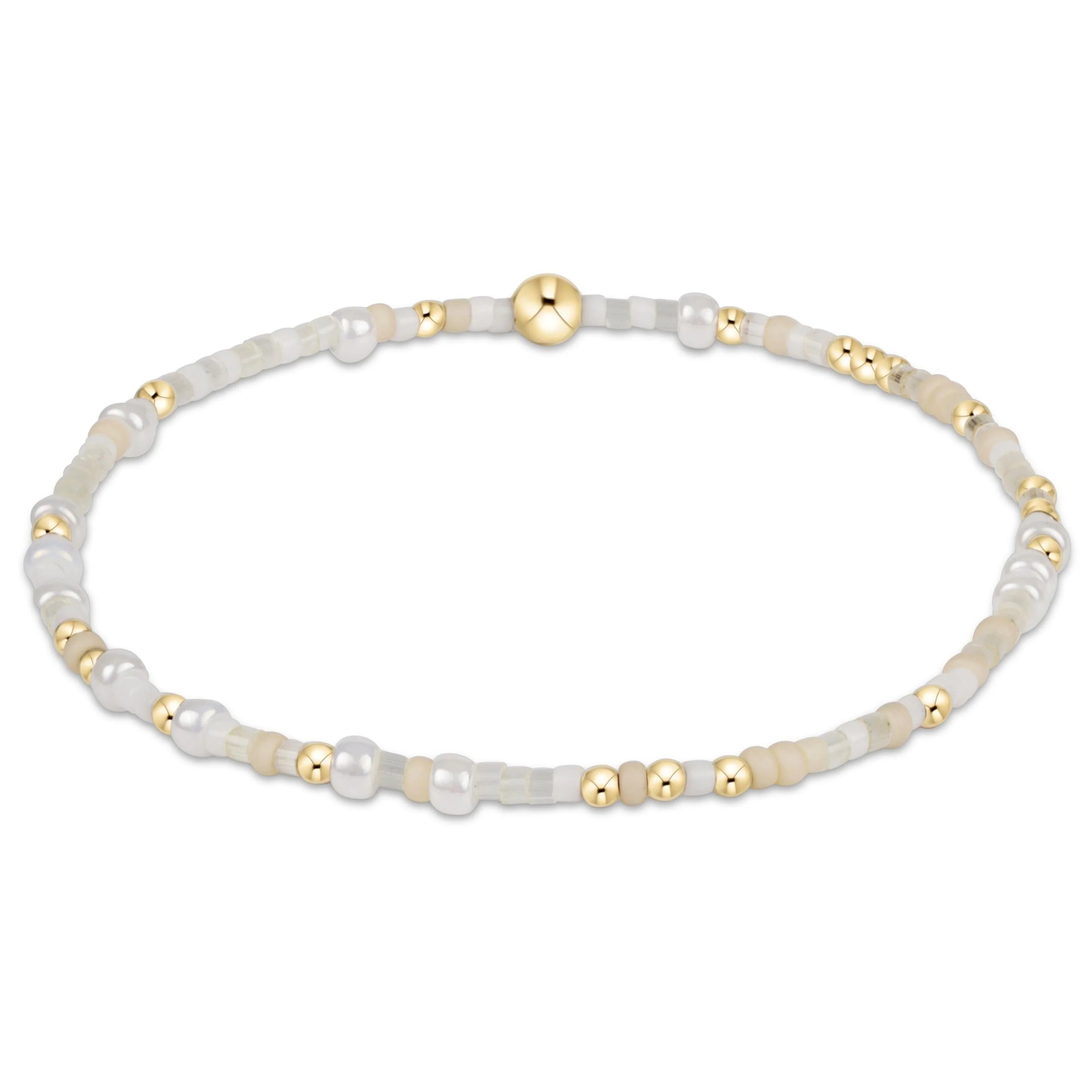 Bracelet with white and gold beads on a white background