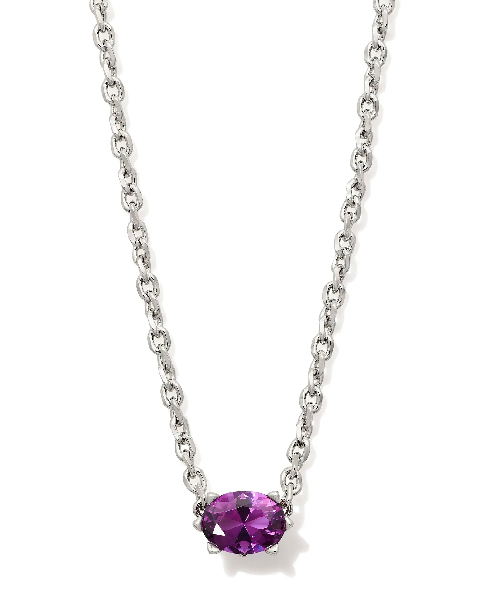 Silver necklace with a purple gemstone on a white background