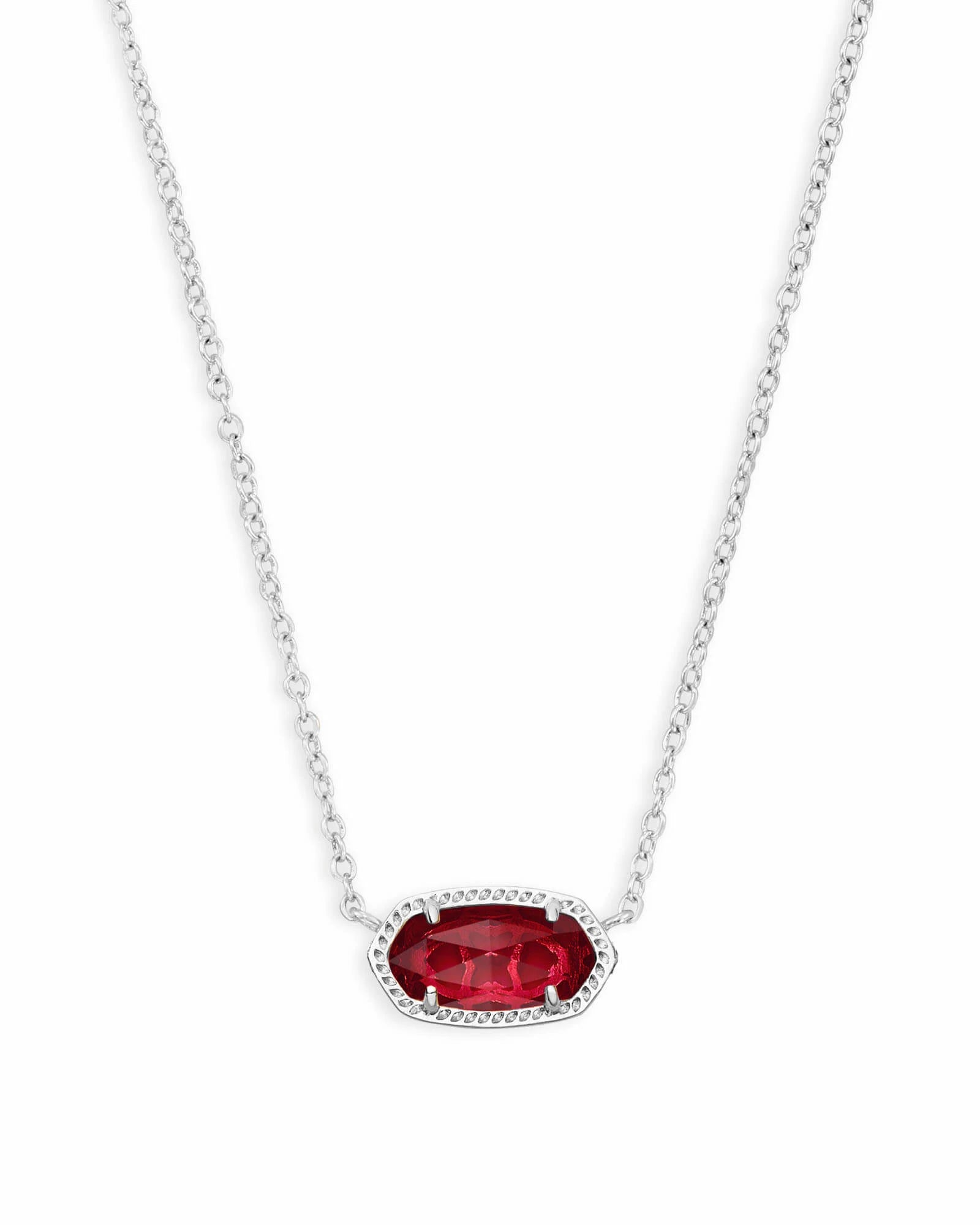 silver necklace with red gemstone