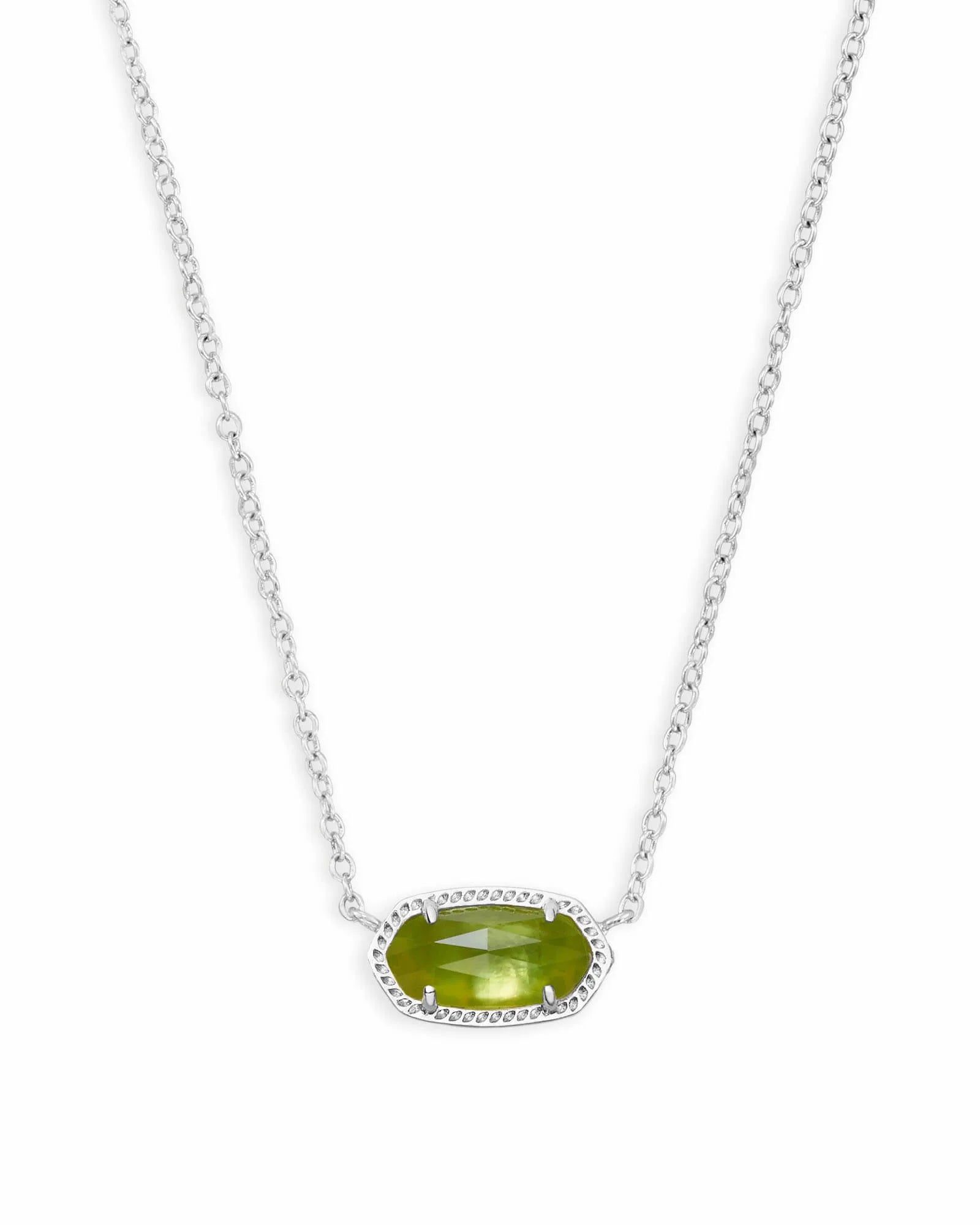 silver necklace with green gemstone pendant