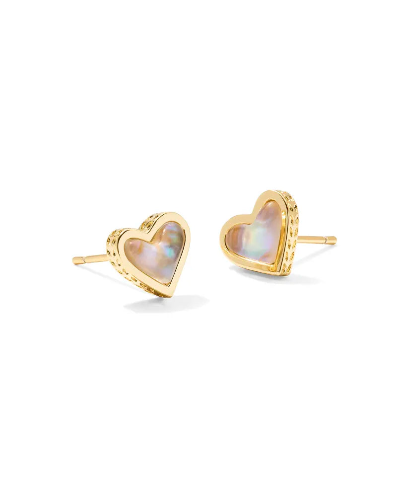 Heart-shaped earrings with gold frame and mother-of-pearl center on a white background