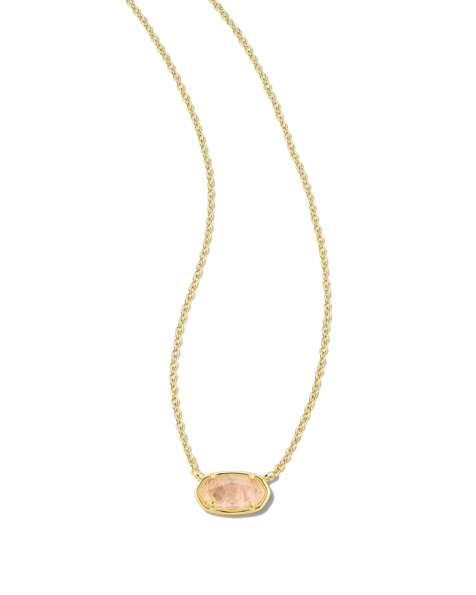 Gold necklace with a pink pendant on a white background