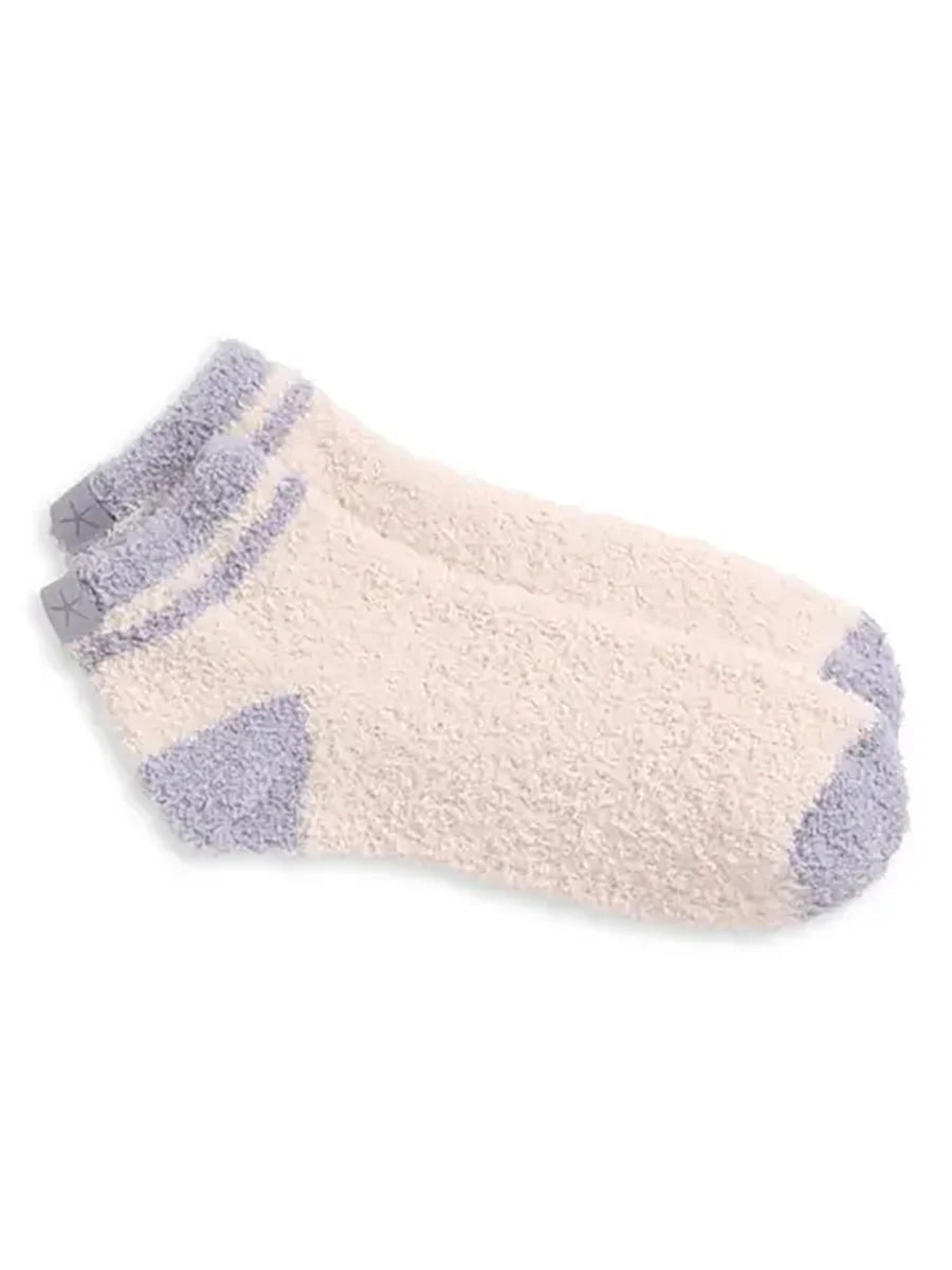 Pair of beige and gray socks on a white background