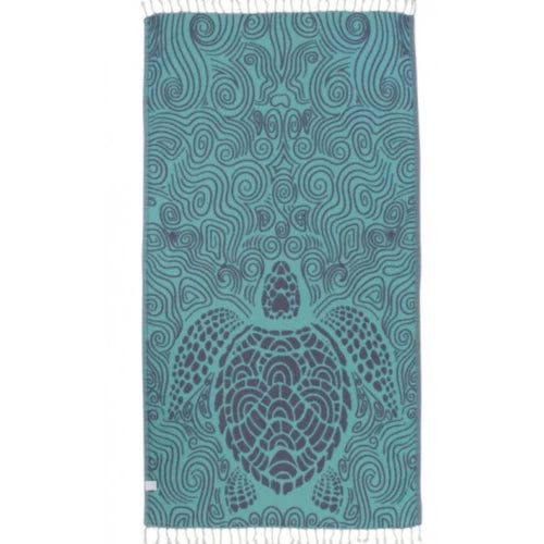 A turquoise towel with a turtle pattern and abstract swirls, featuring fringed ends.