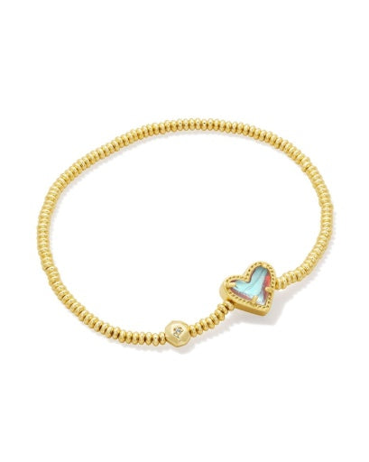 Gold bracelet with a heart-shaped charm on a white background