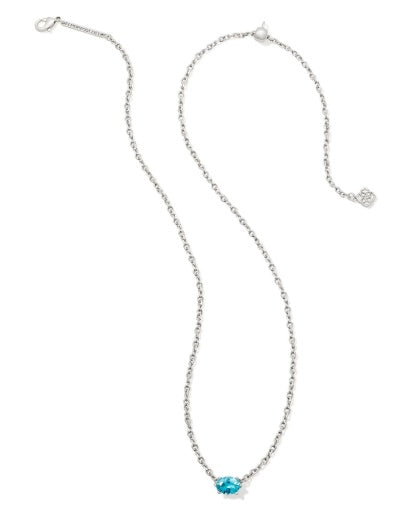 Necklace with a blue gemstone on a white background