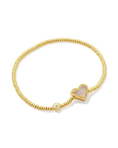 Gold bracelet with a heart-shaped clasp on a white background