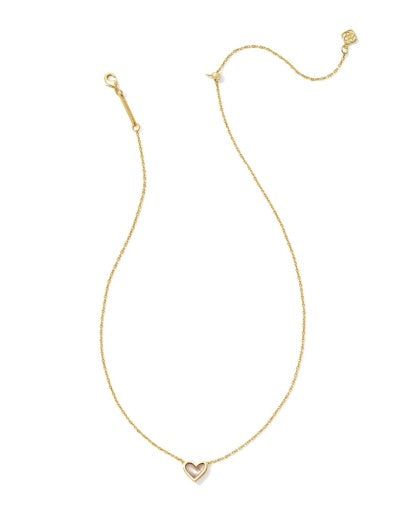 Gold necklace with a heart pendant on a white background