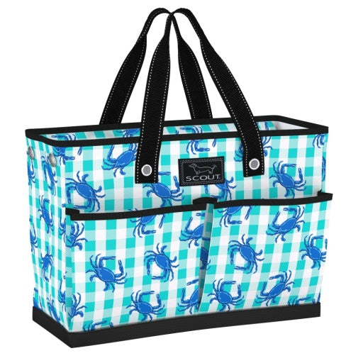 A large tote bag with a blue checkered pattern and blue crab illustrations. The bag has multiple pockets and is shown with black handles.