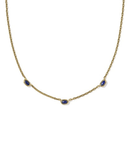 Gold necklace with blue stones on a white background