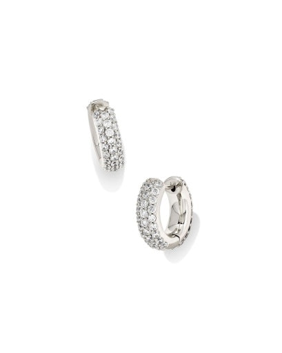 Pair of silver hoop earrings with clear stones on a white background