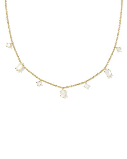 Gold necklace with pearl-like beads on a white background