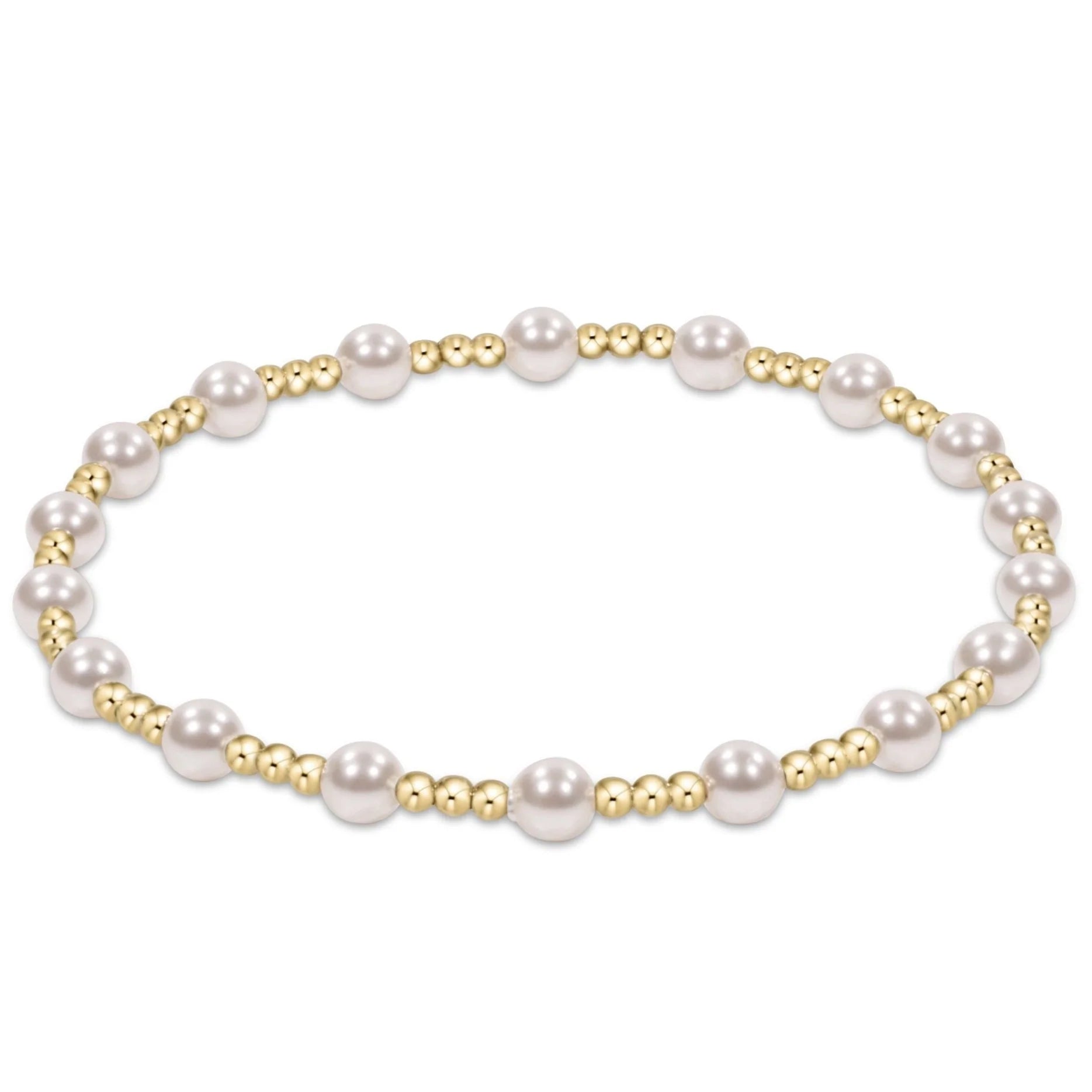 Pearl bracelet with gold accents on a white background