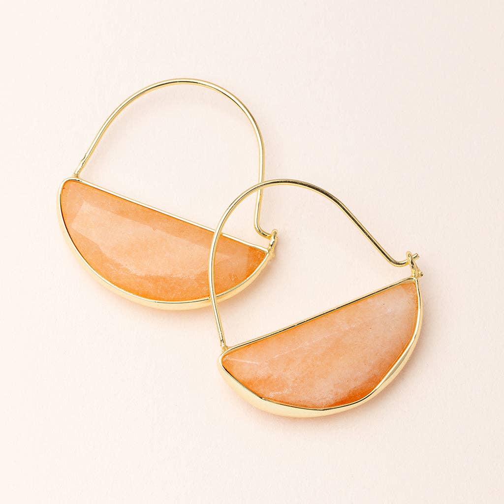 A pair of gold-colored hoop earrings with a semi-precious stone filling, displayed against a light-colored background.