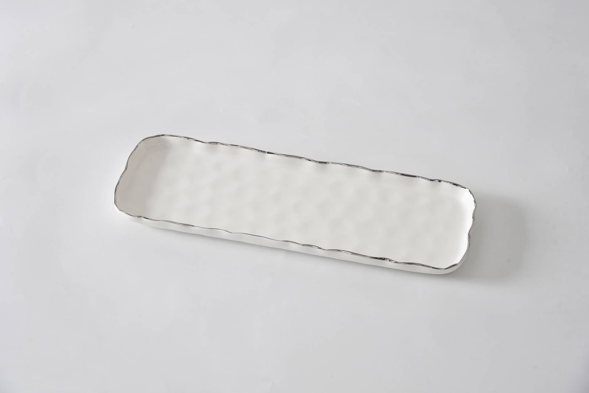 Silver rectangular tray on a light gray background