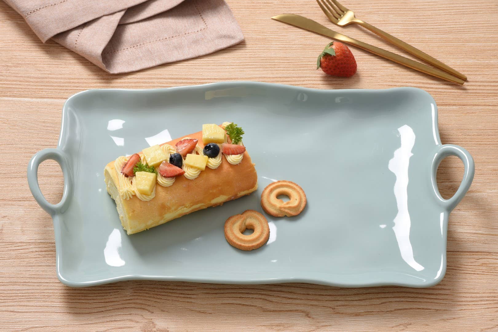 Rectangular serving tray with a dessert on a wooden table