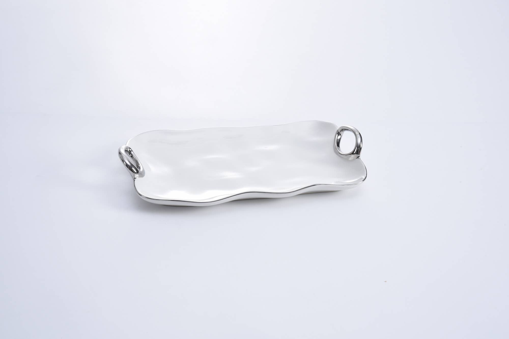 Silver bracelet on a light gray background