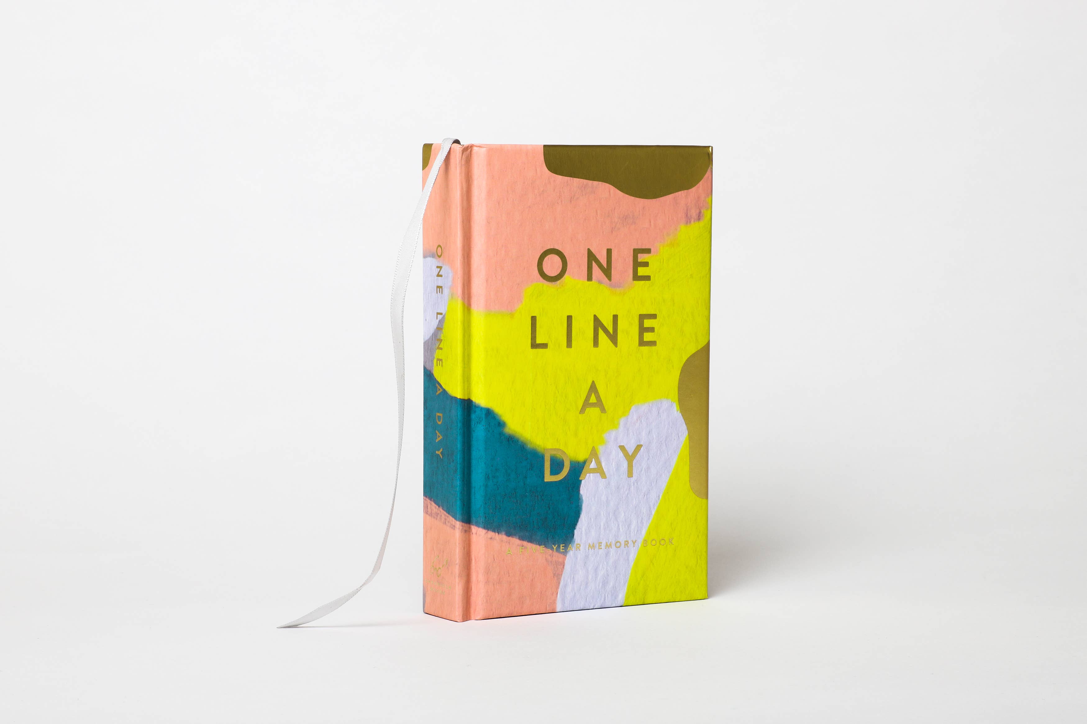 Colorful book titled 'One Line a Day' on a white background